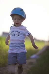 Boy standing on field