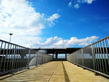 Footbridge against sky