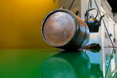 Reflection of barrel on table