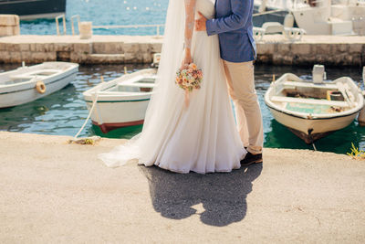 Low section of woman standing on boat