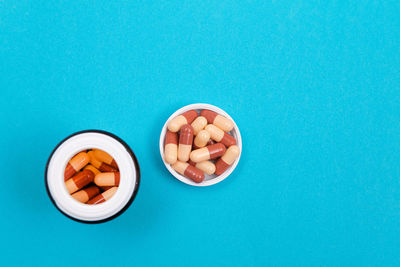 High angle view of ice cream over blue background