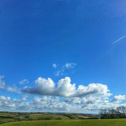 Scenic view of landscape against cloudy sky