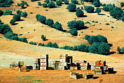 Wooden containers on field