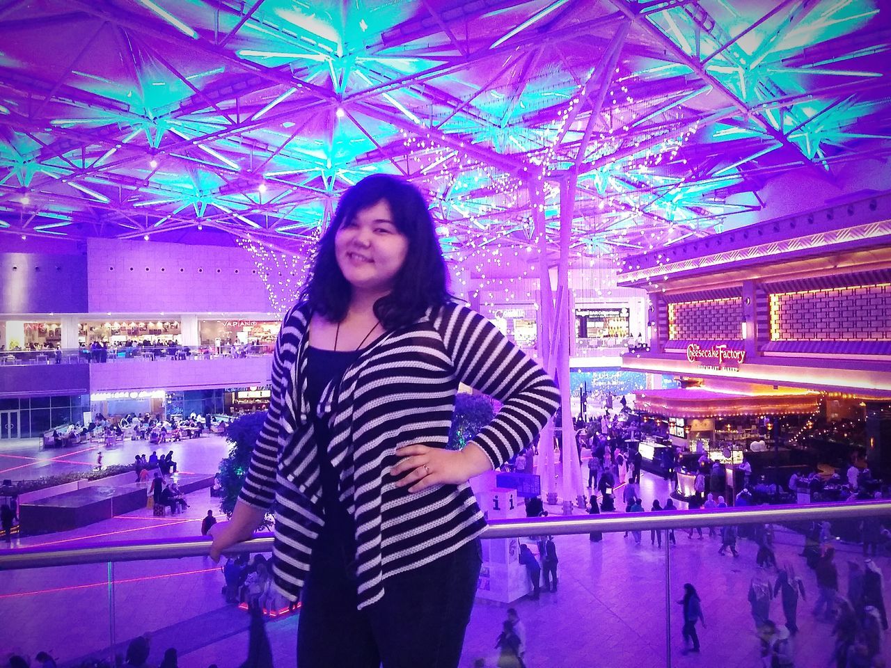 lifestyles, young adult, looking at camera, leisure activity, portrait, young women, casual clothing, person, front view, standing, smiling, indoors, happiness, long hair, enjoyment, waist up