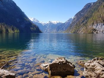 Scenic view of lake and mountains against sky