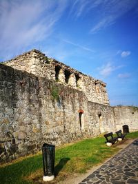 Old ruin building against cloudy sky