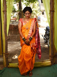 Full length of bride wearing sari