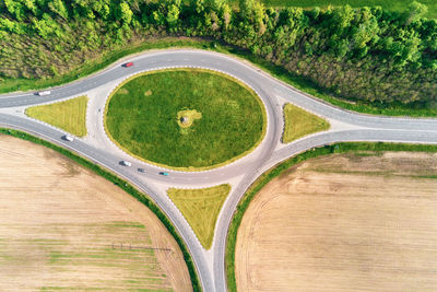 Circle crossroad among fields in countryside, aerial view. transportation infrastructure