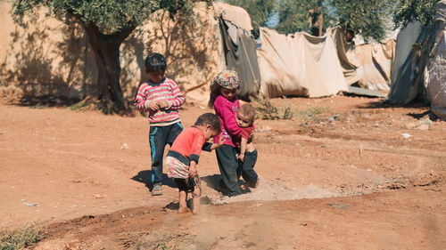 Syrian children inside their tent in the middle of a refugee camp near the turkish border.