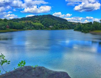 View of calm lake against mountain range