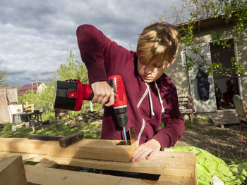 Boy making furniture