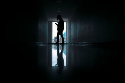 Silhouette woman standing in building