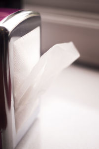 Close-up of white book on table