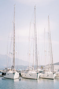 Boats in sea against sky