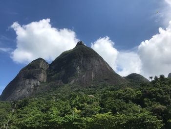 Low angle view of rocky mountain against sky