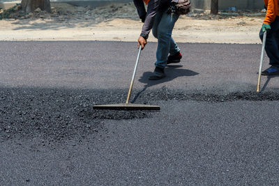 Low section of men working at construction site