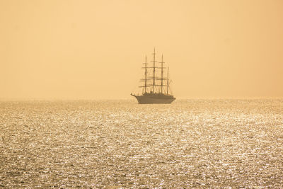 Boat on sea against clear sky