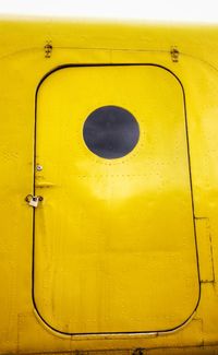 Low angle view of yellow metallic door
