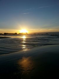 Scenic view of sea at sunset