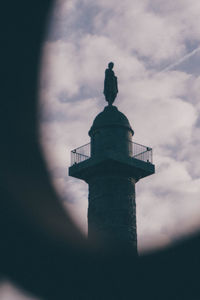 Low angle view of statue against sky