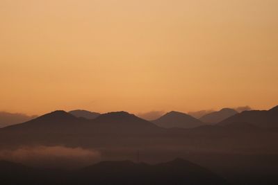 Scenic view of mountains at sunset