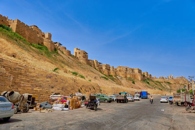 Panoramic view of landscape against blue sky