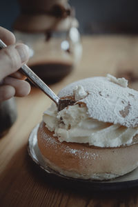 Person eating traditional semla bun