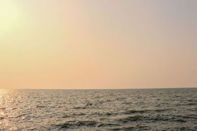 Scenic view of sea against clear sky during sunset