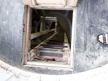 Low section of person standing on staircase of building