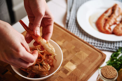 Process of hands peel shrimps shell. woman cleaning shrimps for cooking