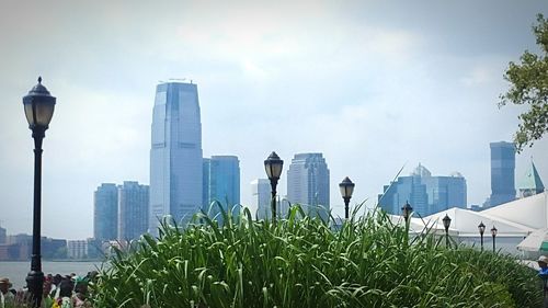 Skyscrapers in city against sky