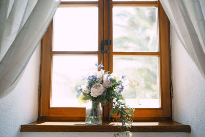 Flower vase on window sill