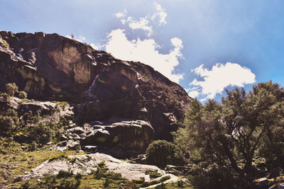 Low angle view of rocks against sky