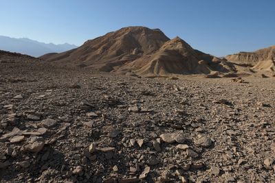 Arid landscape against clear blue sky