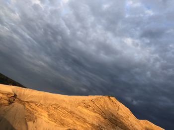 Scenic view of mountain against cloudy sky