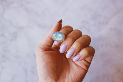 Close-up of woman holding ring