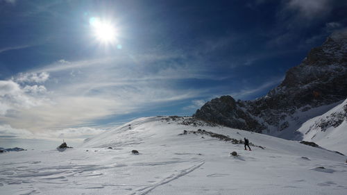 Scenic view of snowcapped mountains against sky