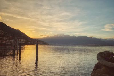 Scenic view of lake against sky during sunset