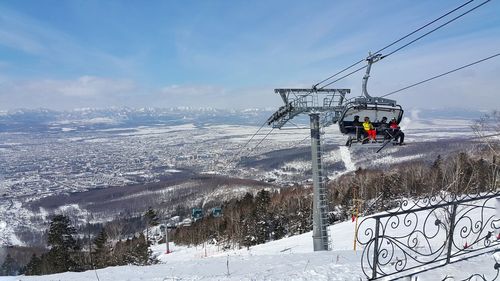 Overhead cable car on snow covered landscape