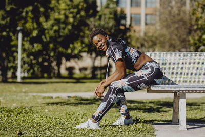 Full length portrait of happy young man in park