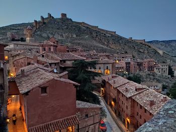 Buildings in city at dusk