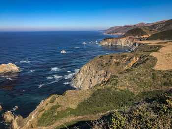 Scenic view of sea against clear blue sky