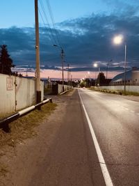 Surface level of empty road against sky