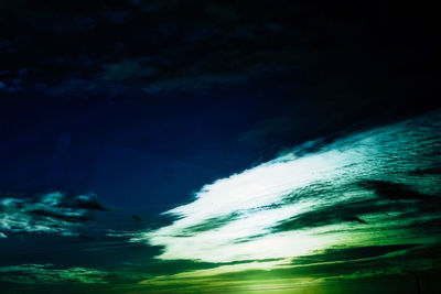 Low angle view of dramatic sky at night
