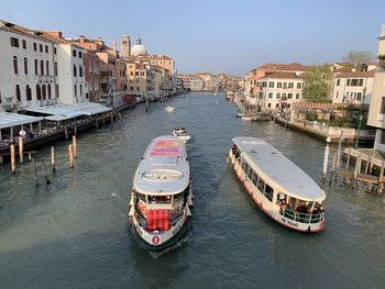 High angle view of canal amidst buildings in city