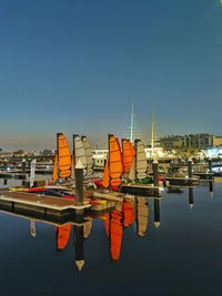 Boats moored at harbor