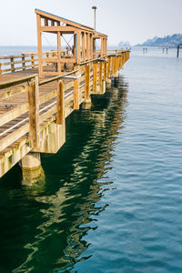 Pier over sea against sky