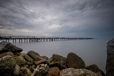 Pier over sea against sky