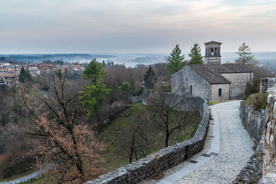 Sunset on the ancient castle of ragogna, italy. fortress guarding the ford on the river tagliamento