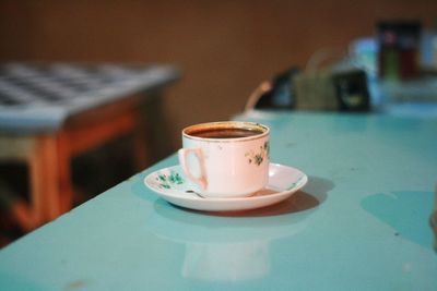 Close-up of coffee cup on table